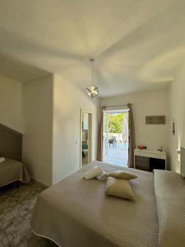 a bedroom with a large bed with two pillows on it at Villa Chiena Forio in Ischia