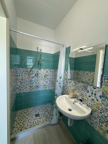 a bathroom with a sink and a shower at Villa Chiena Forio in Ischia