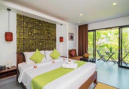 Postel nebo postele na pokoji v ubytování Angkor Home 27