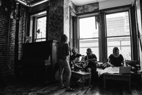 a group of people sitting in a living room at Hostel Fish in Denver
