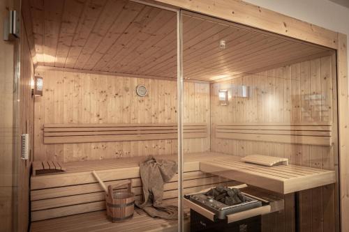 a room with a sauna with a bench in it at Villa JoJo Seafront in Ayia Napa
