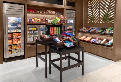 a grocery store aisle with a display of food at Embassy Suites Fort Myers - Estero in Estero