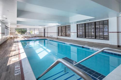 a large swimming pool in a building at Hampton Inn Newport News-Yorktown in Newport News