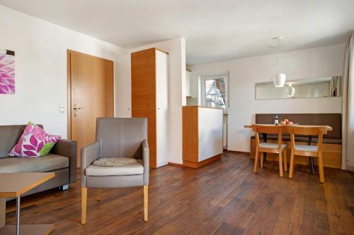 a living room with a couch and a table at Obst- und Ferienhof Lehle in Immenstaad am Bodensee