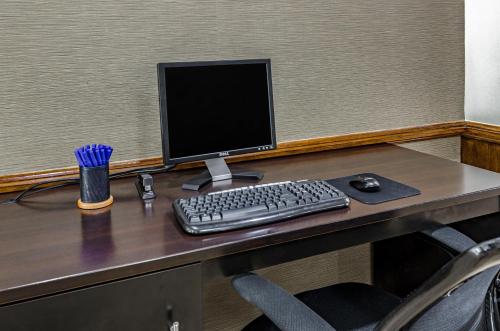a computer monitor and a keyboard on a desk at Sleep Inn Boone University Area in Boone