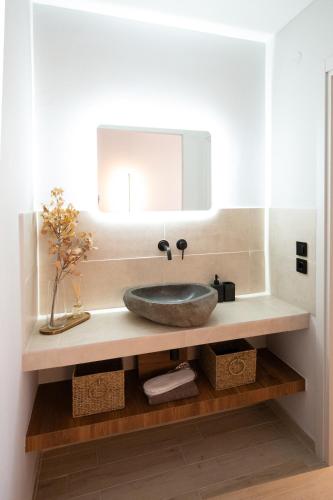 a bathroom with a sink and a mirror at Dwell House 5 in Ioannina