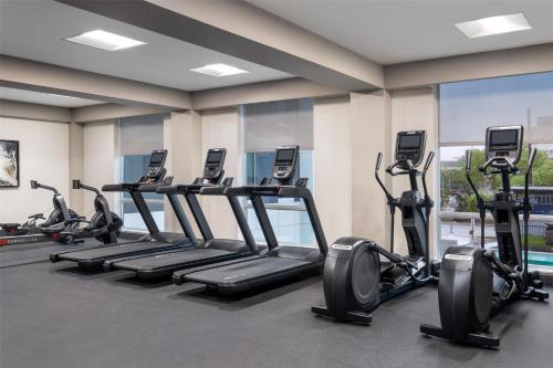 a gym with treadmills and elliptical machines at Home2 Suites By Hilton Houston Downtown Convention Center in Houston
