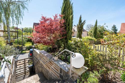 a bathroom in a garden with trees at Carpe Diem - Ferienwohnung in Görlitz