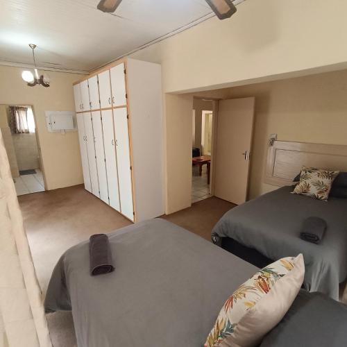 a bedroom with two beds and a closet at Cottage at Yellowstone in Springs