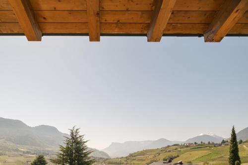 a view of the mountains from a house at Appartement KroneLiving in Tirolo