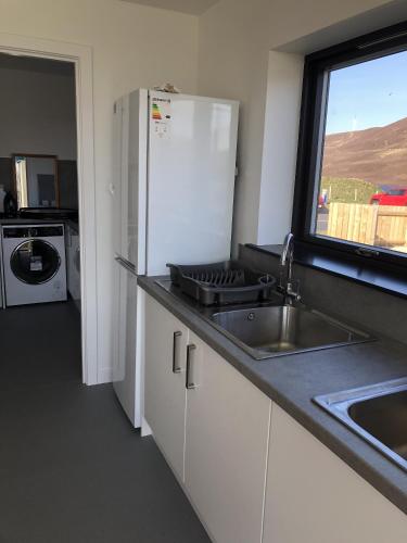 Kuchyň nebo kuchyňský kout v ubytování Scalloway Caravan Park