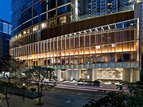 a tall building with a street in front of it at EAST Hong Kong in Hong Kong