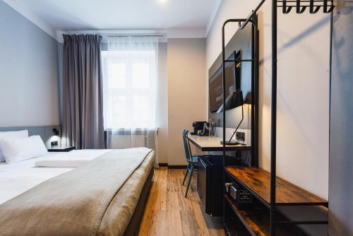Ένα ή περισσότερα κρεβάτια σε δωμάτιο στο Aparthouse Woźna 11 Old Town