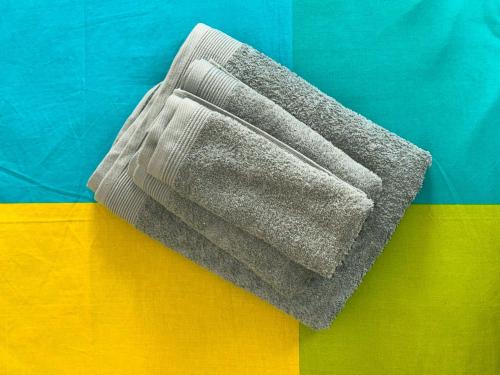 a sock on top of a colorful blanket at Casa Mariuccia in Ponzone