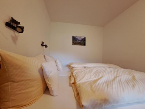 Postel nebo postele na pokoji v ubytování Landhaus Via Decia - Bad Hindelang PLUS Partner