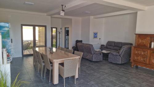 a living room with a table and chairs and a couch at Casa Damian DROBETA in Drobeta-Turnu Severin