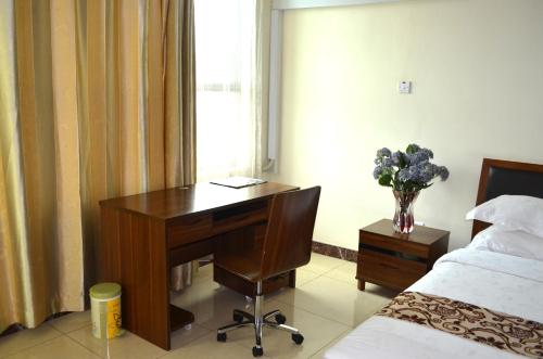 Postel nebo postele na pokoji v ubytování Mt. Zion Hotel