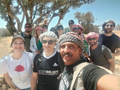 a group of people posing for a picture at Dana Village experience hotel in Dana