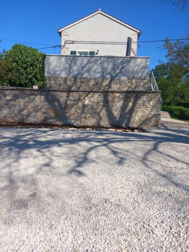 a shadow of a fence on a wall at Apartment 2323 in Foli