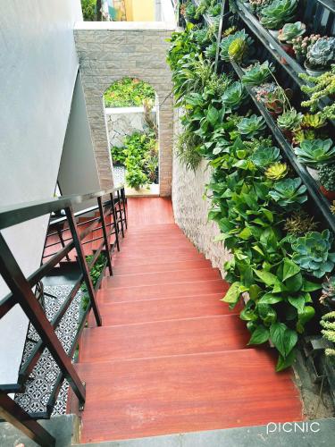 a staircase with plants on the side of a building at Sapa Villa Florence in Sa Pa