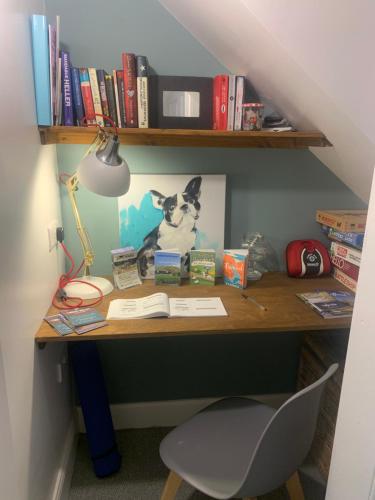 a desk with a picture of a dog on it at Stravaig in Innerleithen