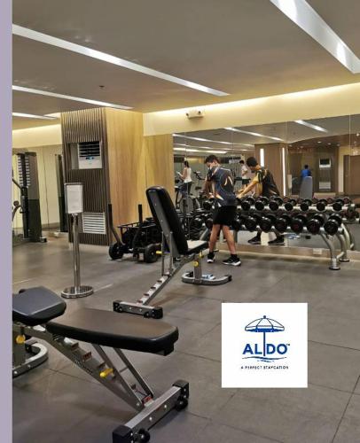 a group of people in a gym with machines at Mall of Asia condotel shore 3 residence in Manila