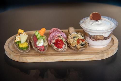 a plate of food with a dessert and aifle at Főtér Rezidencia in Győr