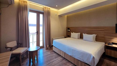 a hotel room with a bed and a window at Hotel Bankir Khiva in Khiva