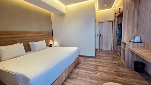 a bedroom with a large bed in a room at Hotel Bankir Khiva in Khiva