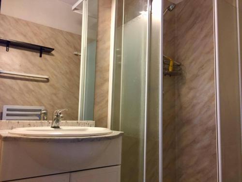 a bathroom with a sink and a shower at Appartement 2 pièces La Rochelle - LR030-B11 in La Rochelle