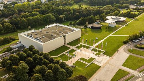 an aerial view of a large building in a park at GITE A THEME D-DAY - situé à 15mn d'Omaha Beach - Animaux OK - Terrain clos - Aucuns voisins in Cartigny-lʼÉpinay
