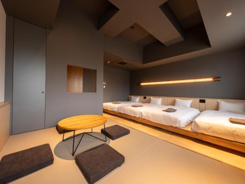 Una cama o camas en una habitación de Onn Oomagarinohanabi