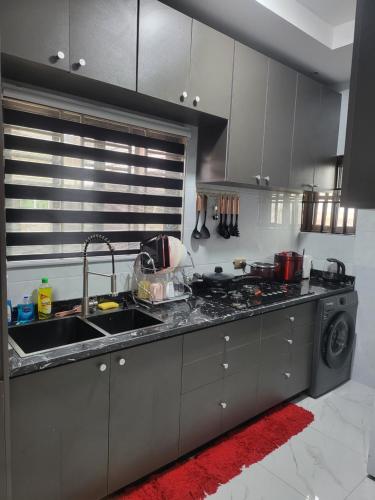 Nhà bếp/bếp nhỏ tại Accra Apartments