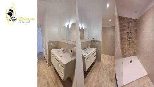 une salle de bain blanche avec deux lavabos et une douche dans l'établissement Casa Chjara, à Zonza