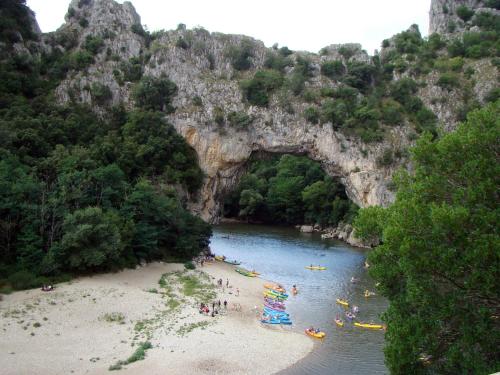 a group of people on a beach in a river at Paradis Provencal Le Calme total, Grande Piscine et Jacuzzi Chauffé, Salle de Jeux et Fresque du Nougat, Intimité in Montélimar