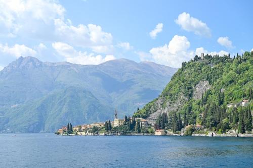 a large body of water with mountains in the background at Sognando Varenna-Lake Como View- in Fiumelatte