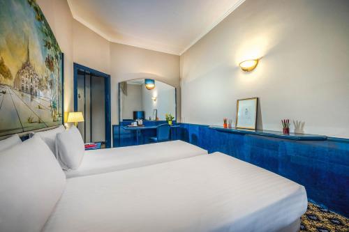 Postel nebo postele na pokoji v ubytování iH Hotels Milano Ambasciatori