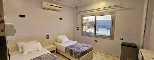 Postel nebo postele na pokoji v ubytování Rayan Nubian Guest House