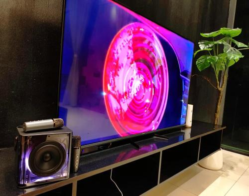 a tv with a red light on top of it at Cyberjaya Puchong JWJ Pool Villa in Cyberjaya