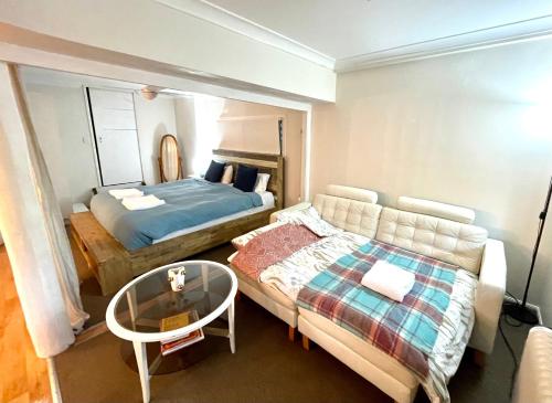 Postel nebo postele na pokoji v ubytování Gin's Rainforest stay -pet friendly