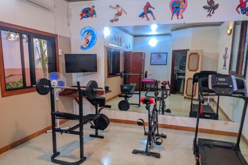 a gym with exercise equipment in a room at LE NOUVEL EDEN in Toliara