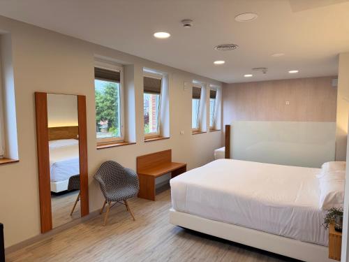 Postel nebo postele na pokoji v ubytování Hotel Marqués de Aguilar