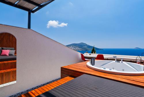 a bath tub on the deck of a boat at Lupia Suites in Kalkan