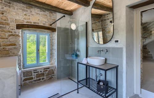 a bathroom with a sink and a mirror at Villa Casa Jovanin in Livade