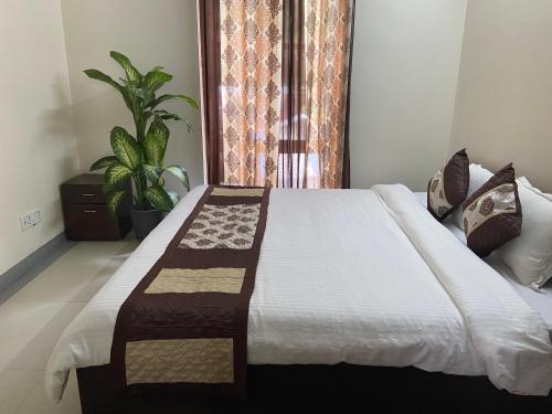 Una cama o camas en una habitación de GUHAS Villa