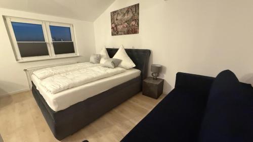 Ένα ή περισσότερα κρεβάτια σε δωμάτιο στο A&O Suites