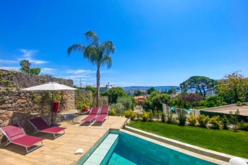 Photo de la galerie de l'établissement Golfe-JuanCannes Modern 3-bedroom villa with swimming pool and sea view, à Vallauris
