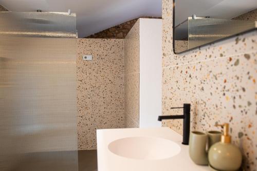 a bathroom with a sink and a mirror at Casa Rural Mas Homs in Parets de Dalt