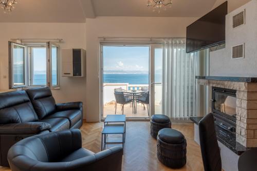 APARTMENTS BRUNO 1&2 - two-room penthouse apartments - wonderful panoramic view of the sea - the best location, first row to the beach - 10 minutes from Supetar ferry port - free secured parking - facilities nearby