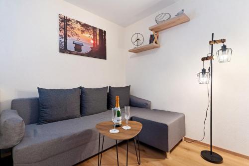 a living room with a couch and a table at Schwarzwaldliebe in Oberharmersbach